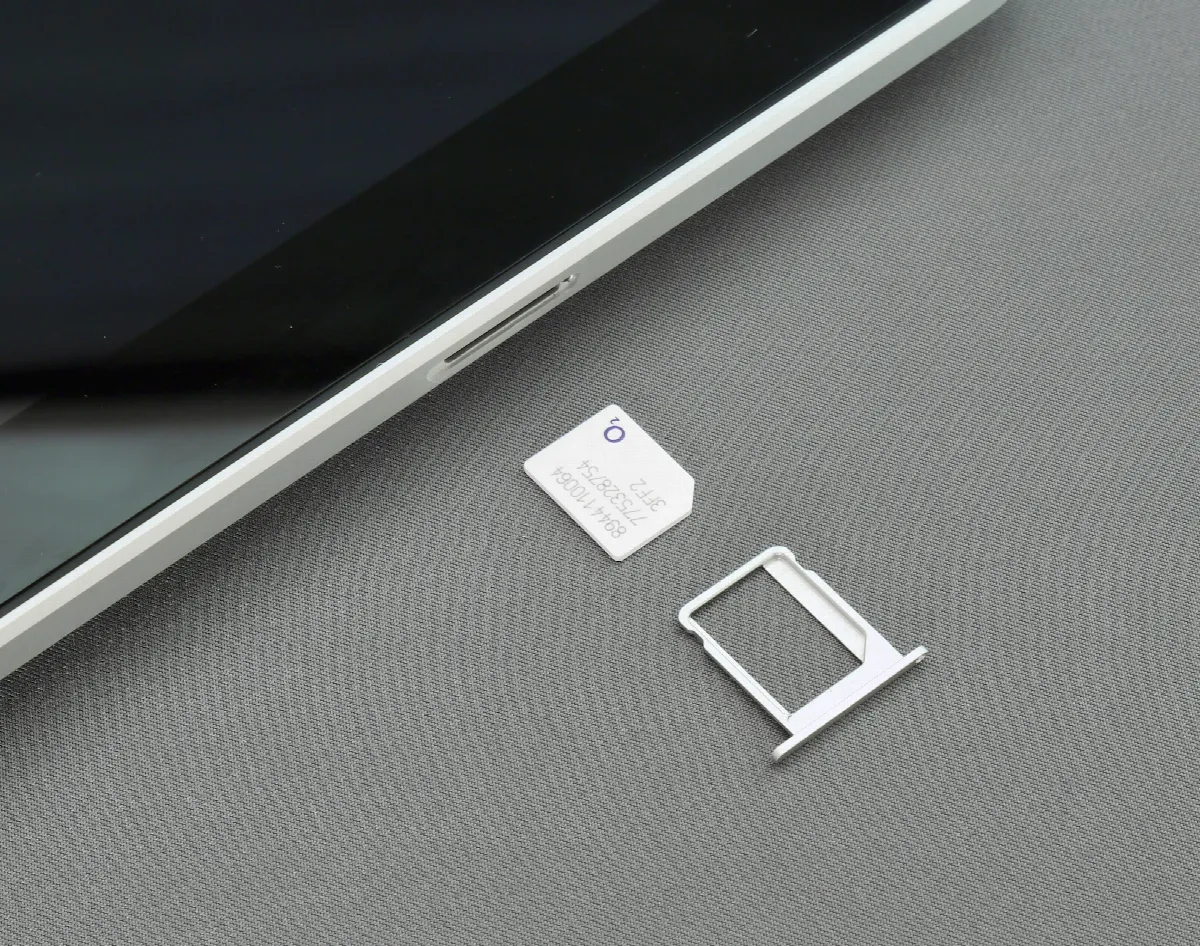A single SIM card resting on a flat surface, shown up close