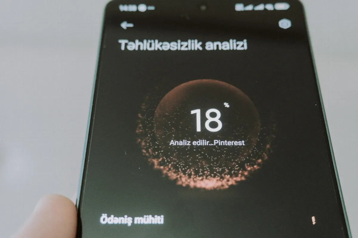 A smartphone screen showing a risk readout of 18, much like a low phone number fraud score