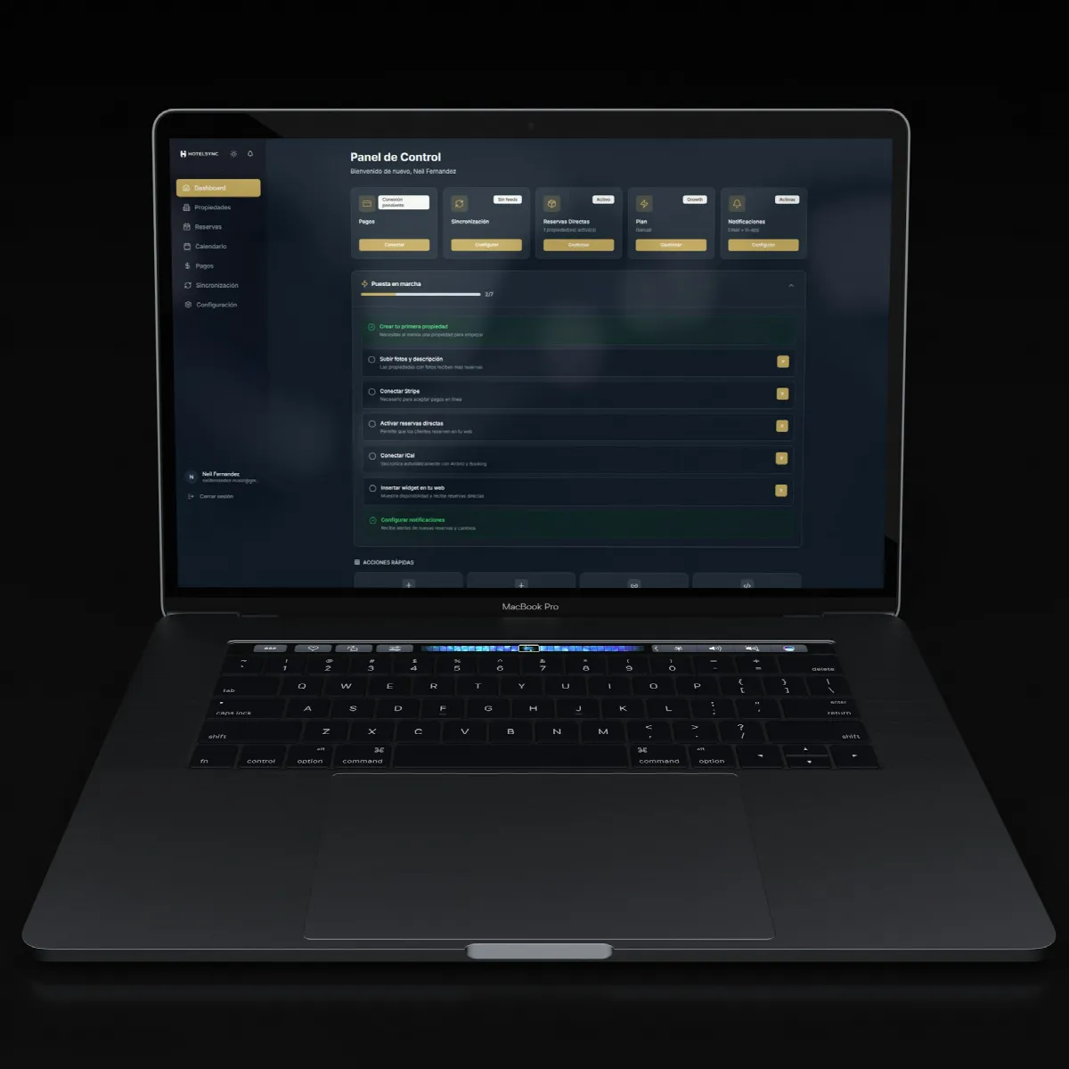 A laptop on a desk displaying a dark-themed dashboard with charts and data, the kind of view where phone number enrichment shows up for a sales team